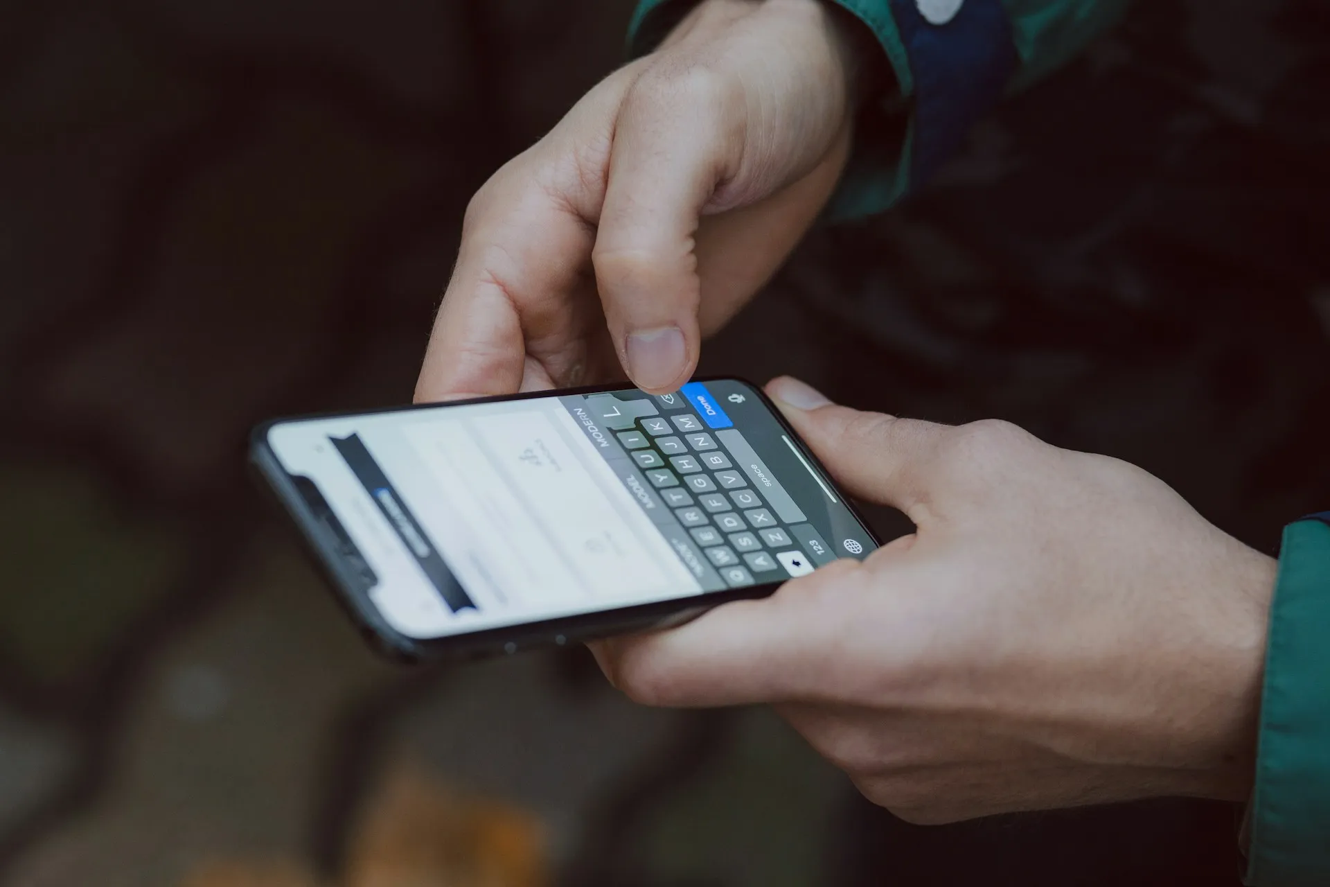 Person typing a message on a smartphone