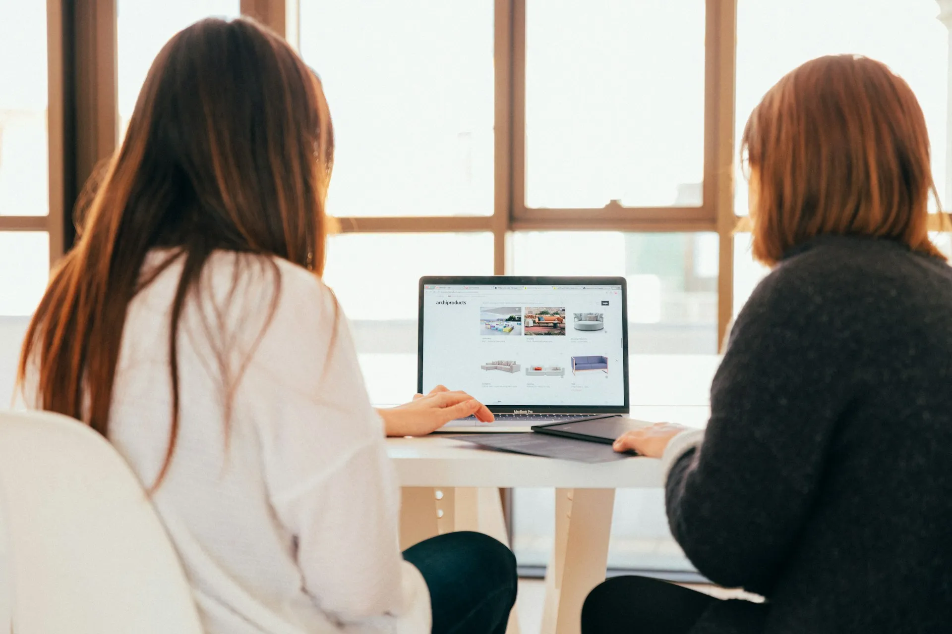 Professionals reviewing product options together during a business discussion