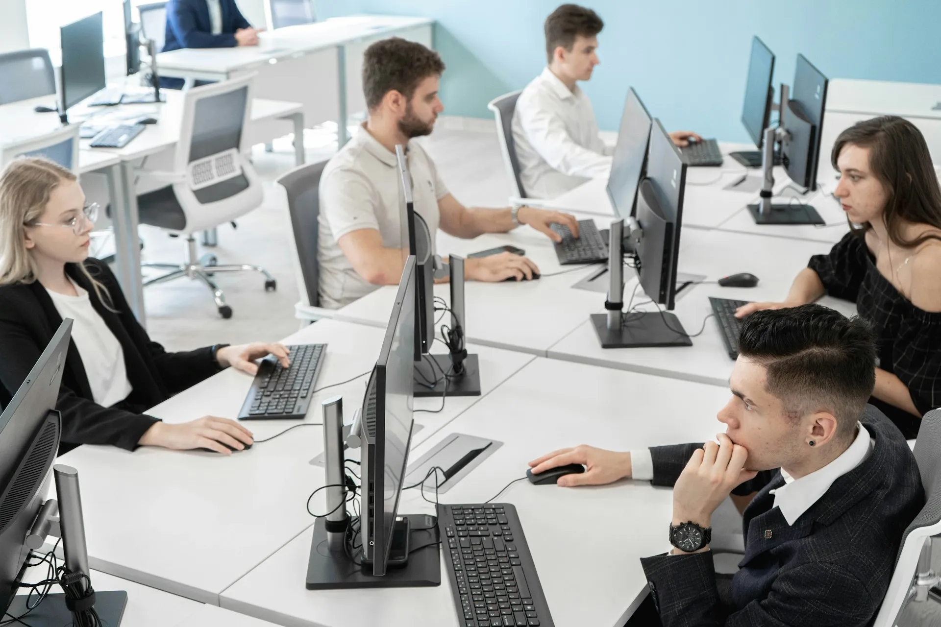 A customer service team working together in a professional office